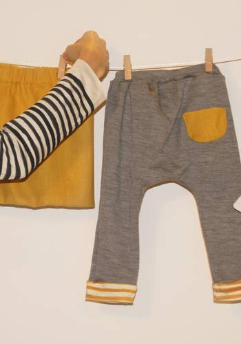 Pantalone in lana con tasca e risvolto a contrasto